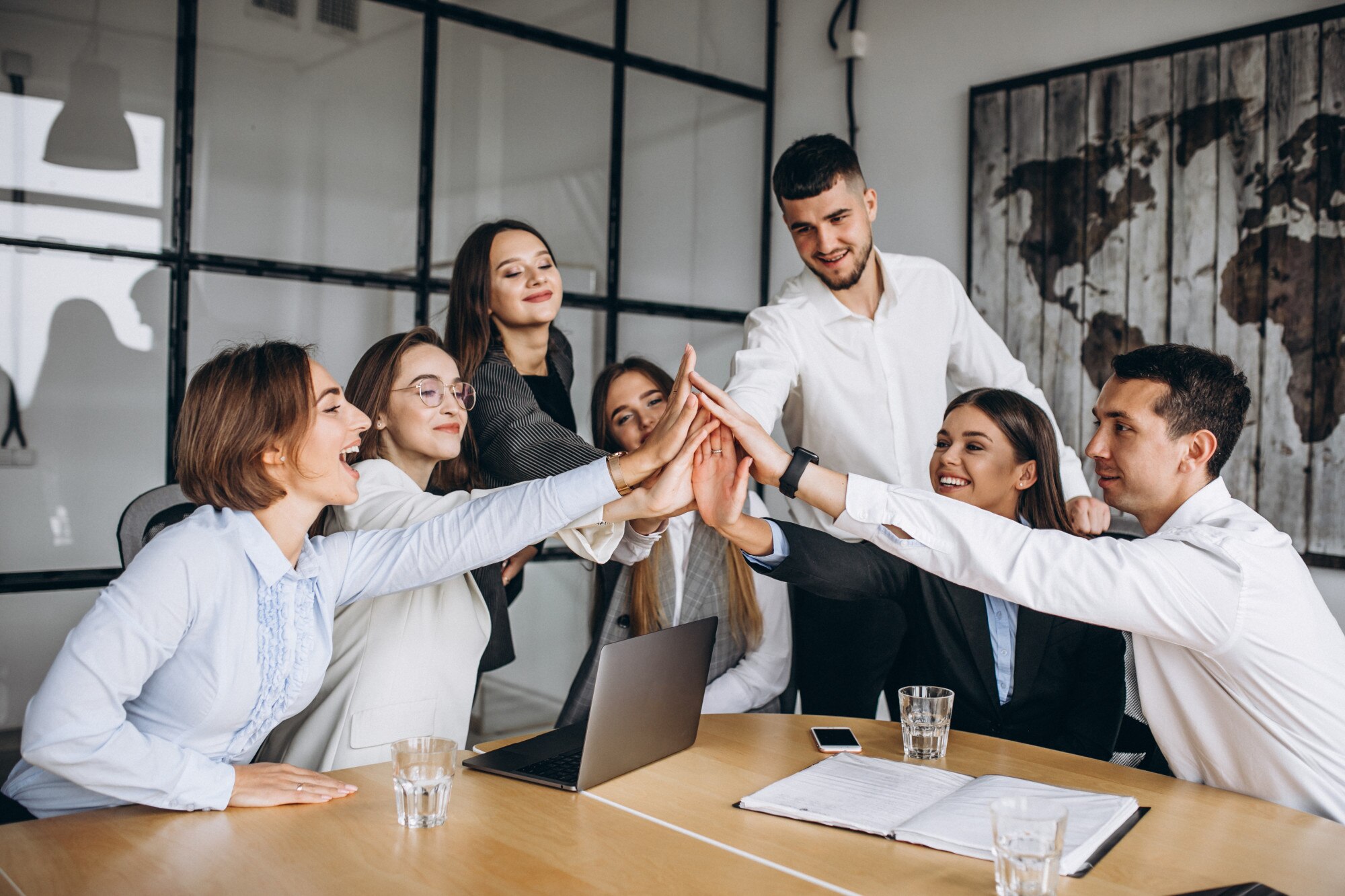 Group of people working out a business plan in an office, discussing employee engagement strategies